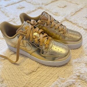 Never worn -Nike metallic Gold Womans air force 1s